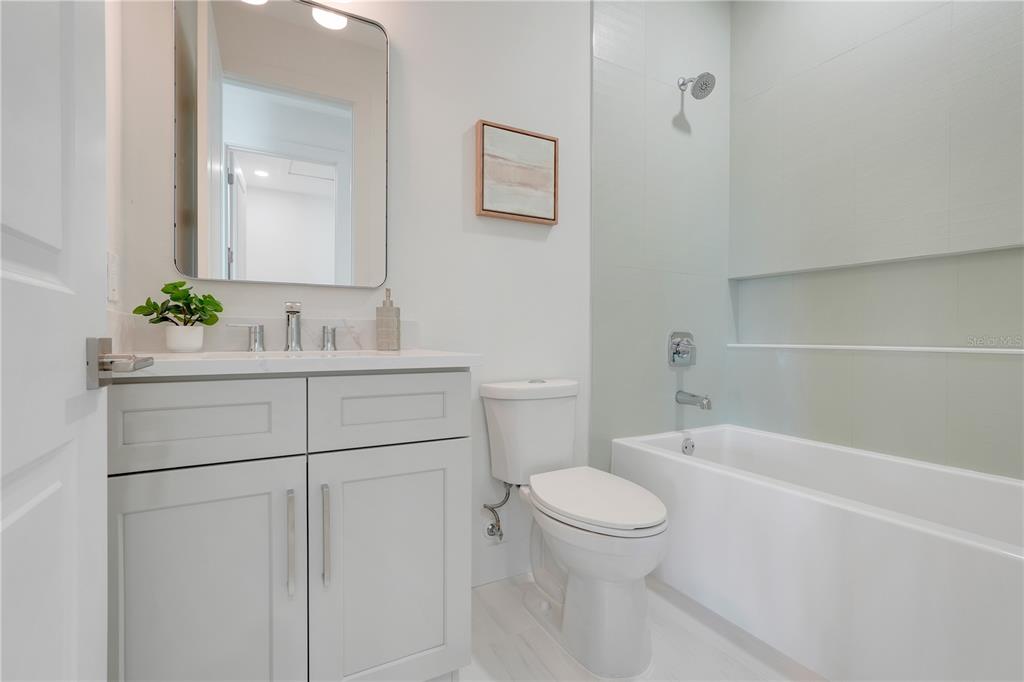 3496 Amberjack Drive Hernando Beach, FL 34607 - Photo 23 of 52 a bathroom with a sink a toilet and tub