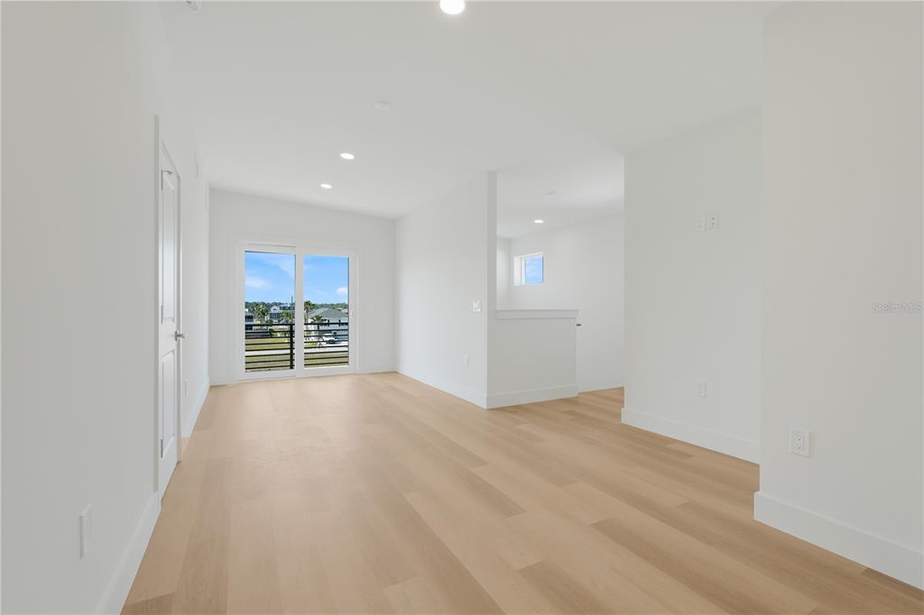 3496 Amberjack Drive Hernando Beach, FL 34607 - Photo 30 of 52 wooden floor in an empty room with a window