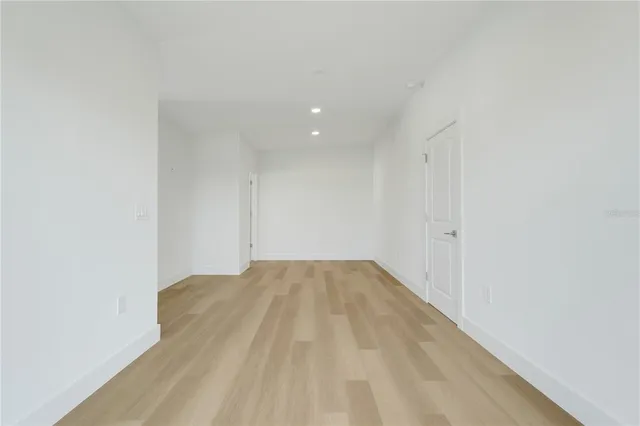 a view of a roof deck with wooden floor and fence