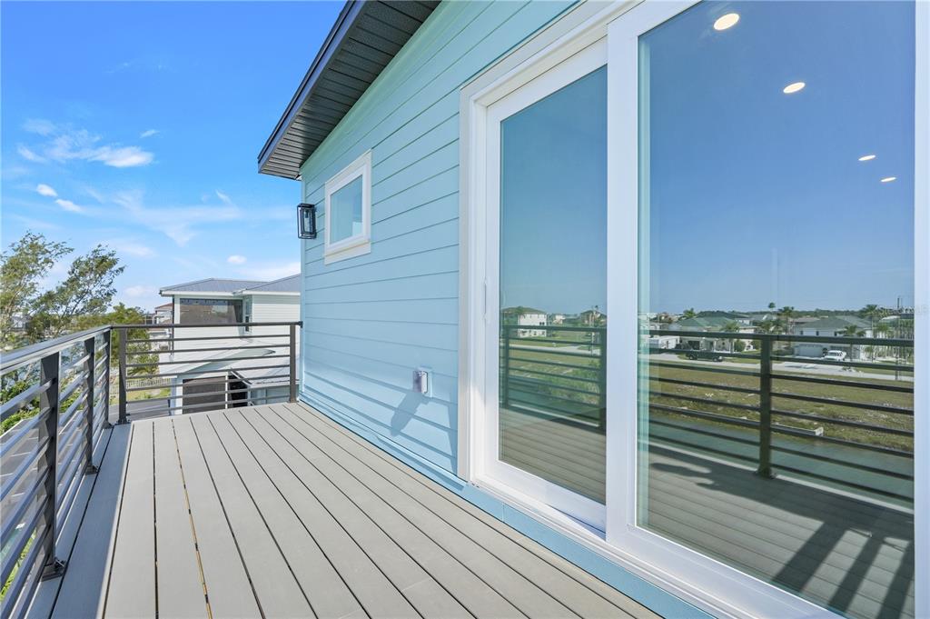 3496 Amberjack Drive Hernando Beach, FL 34607 - Photo 34 of 52 a view of a roof deck with wooden floor and fence