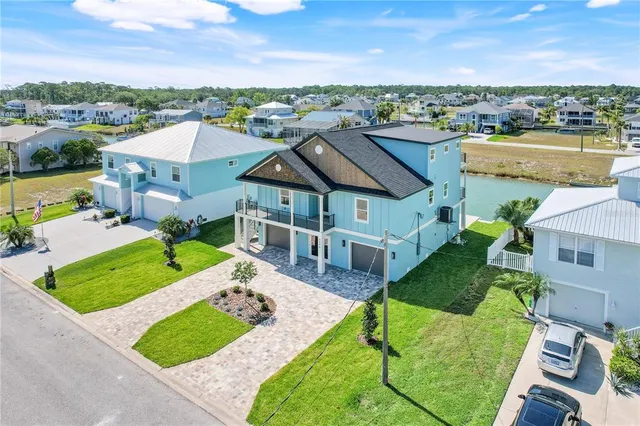 an aerial view of a house with a garden