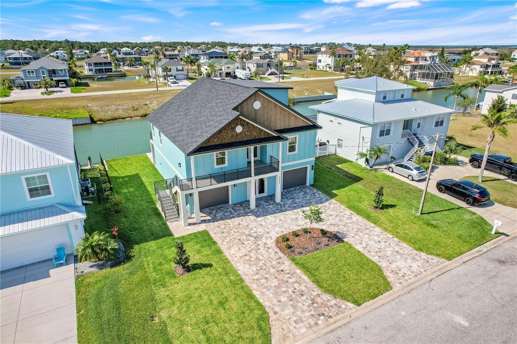 3496 Amberjack Drive Hernando Beach, FL 34607 - Photo 42 of 52 an aerial view of a house with a garden