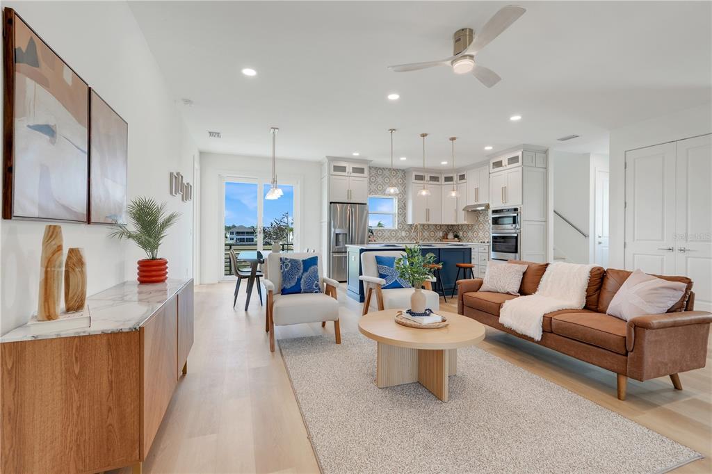 3496 Amberjack Drive Hernando Beach, FL 34607 - Photo 5 of 52 a living room with fireplace furniture and a chandelier