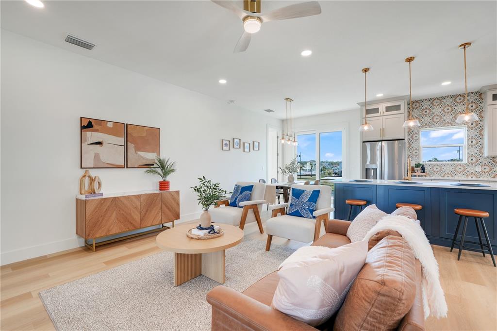 3496 Amberjack Drive Hernando Beach, FL 34607 - Photo 6 of 52 a living room with furniture kitchen view and a chandelier