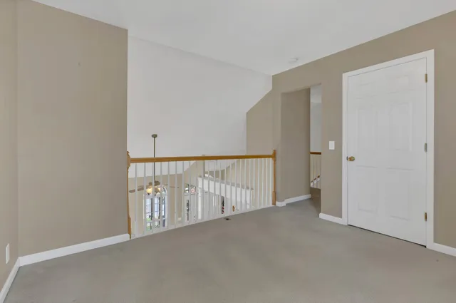 a view of a hallway with staircase