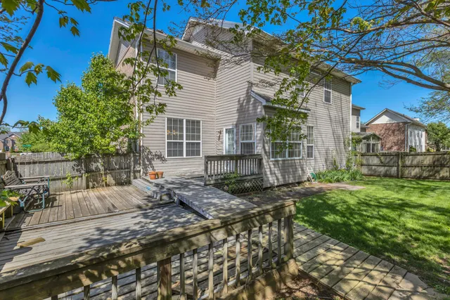 a view of house with backyard
