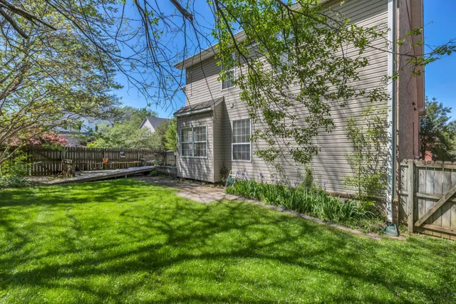 a backyard of a house with lots of green space