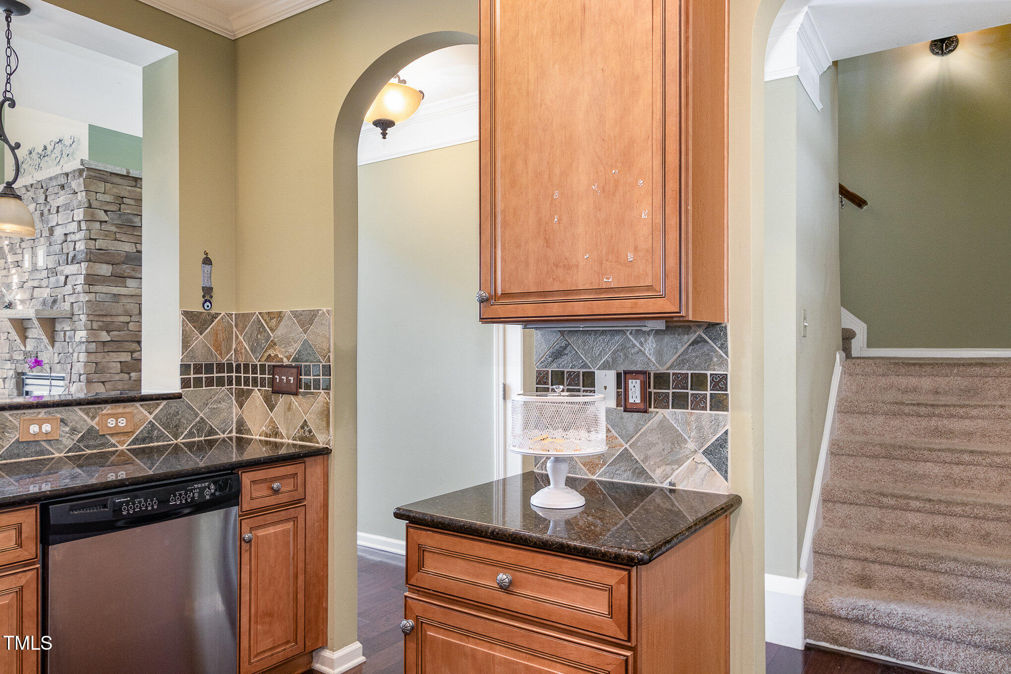 9207 Wooden Road Raleigh, NC 27617 - Photo 10 of 27 a kitchen with granite countertop cabinets and window