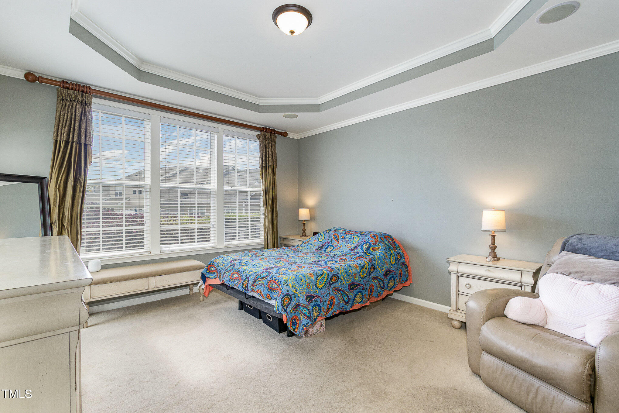 9207 Wooden Road Raleigh, NC 27617 - Photo 12 of 27 a bedroom with a bed and window