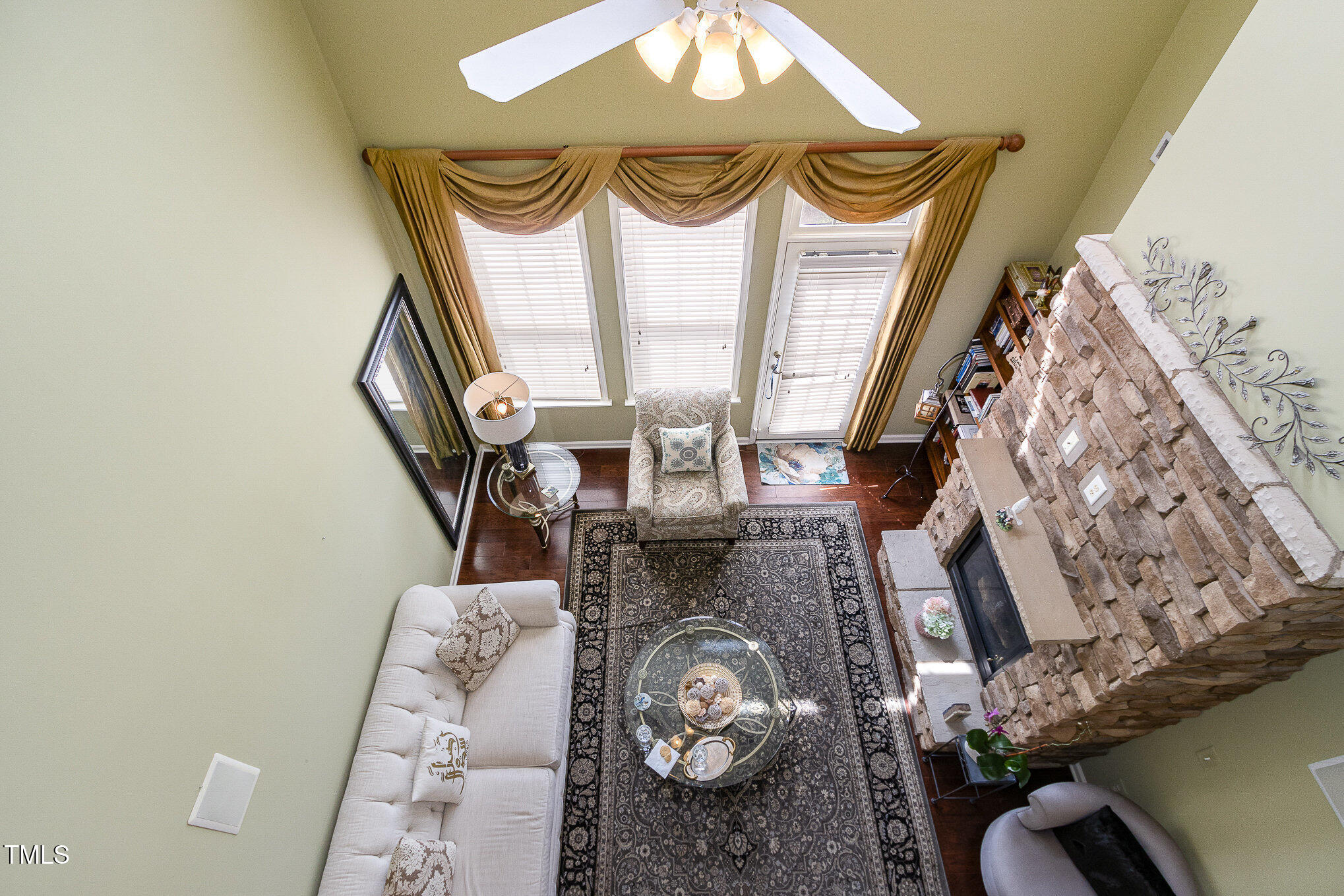 9207 Wooden Road Raleigh, NC 27617 - Photo 16 of 27 a living room with furniture and a fireplace