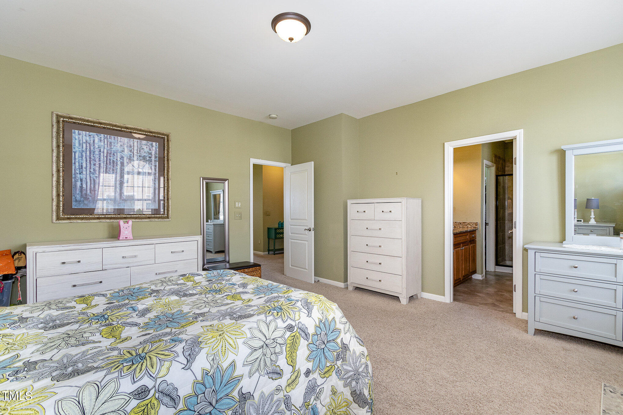 9207 Wooden Road Raleigh, NC 27617 - Photo 19 of 27 a bedroom with a bed dresser and a window
