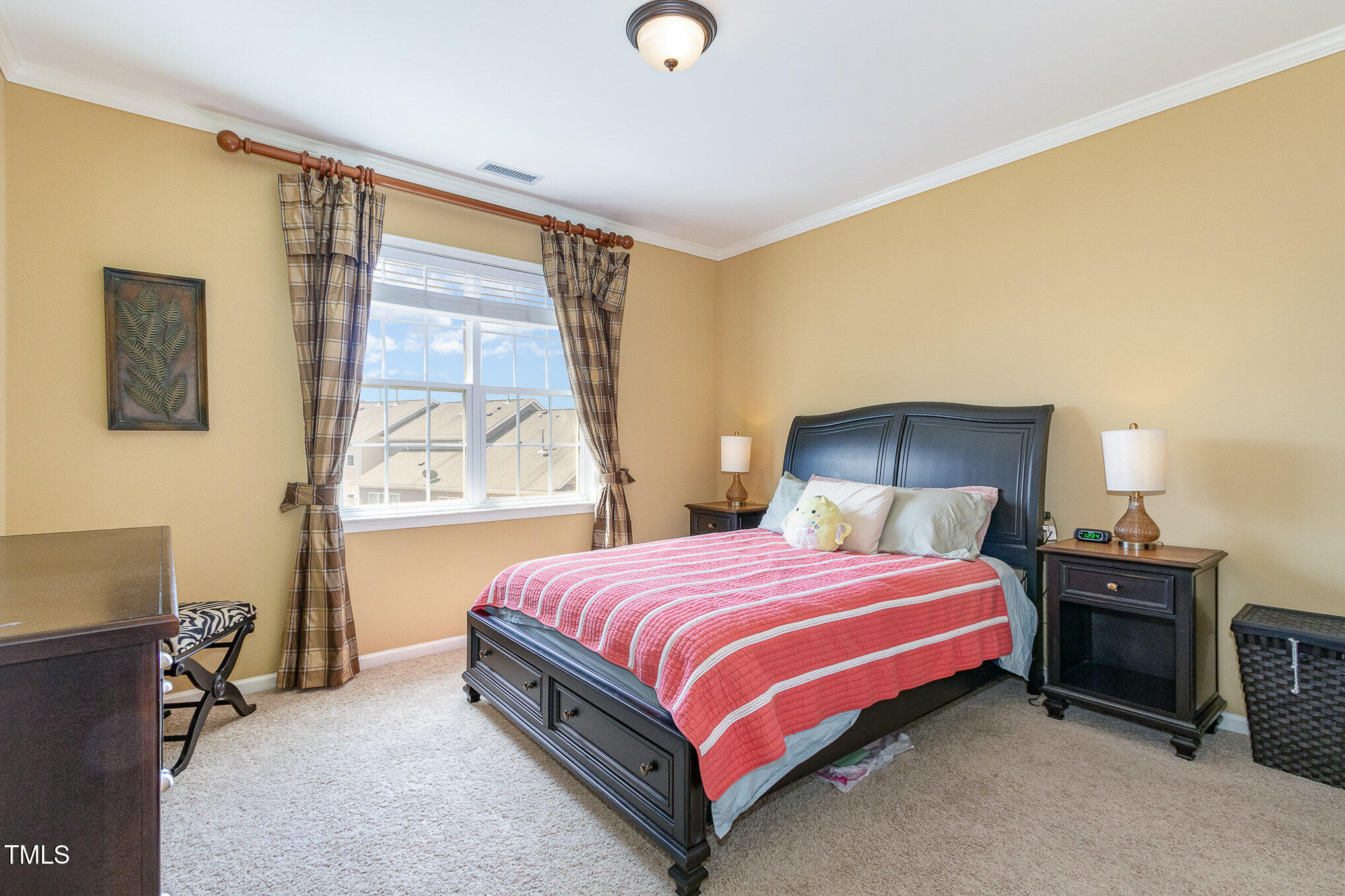 9207 Wooden Road Raleigh, NC 27617 - Photo 22 of 27 a bedroom with a bed and a window