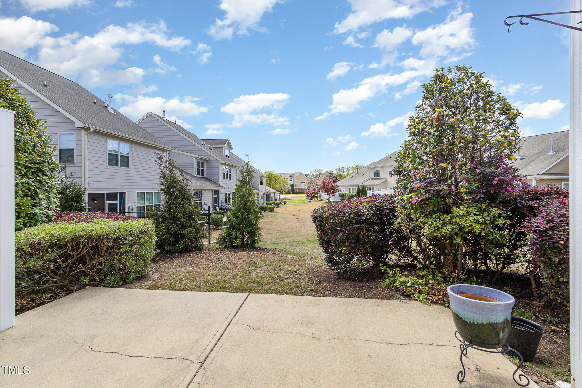 9207 Wooden Road Raleigh, NC 27617 - Photo 24 of 27 a view of a chairs and table in backyard