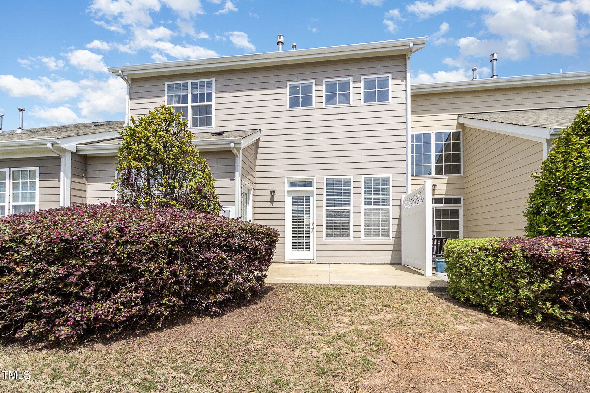 9207 Wooden Road Raleigh, NC 27617 - Photo 25 of 27 front view of a house with a yard