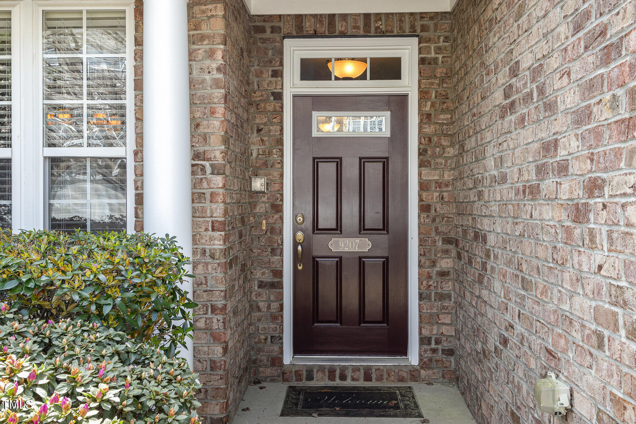 9207 Wooden Road Raleigh, NC 27617 - Photo 4 of 27 a sign that is on the side of a building