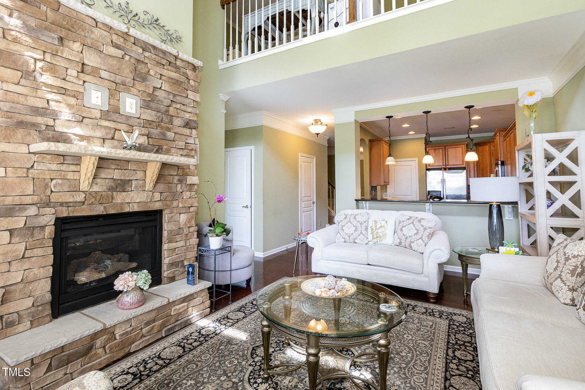 9207 Wooden Road Raleigh, NC 27617 - Photo 6 of 27 a living room with furniture and a fireplace