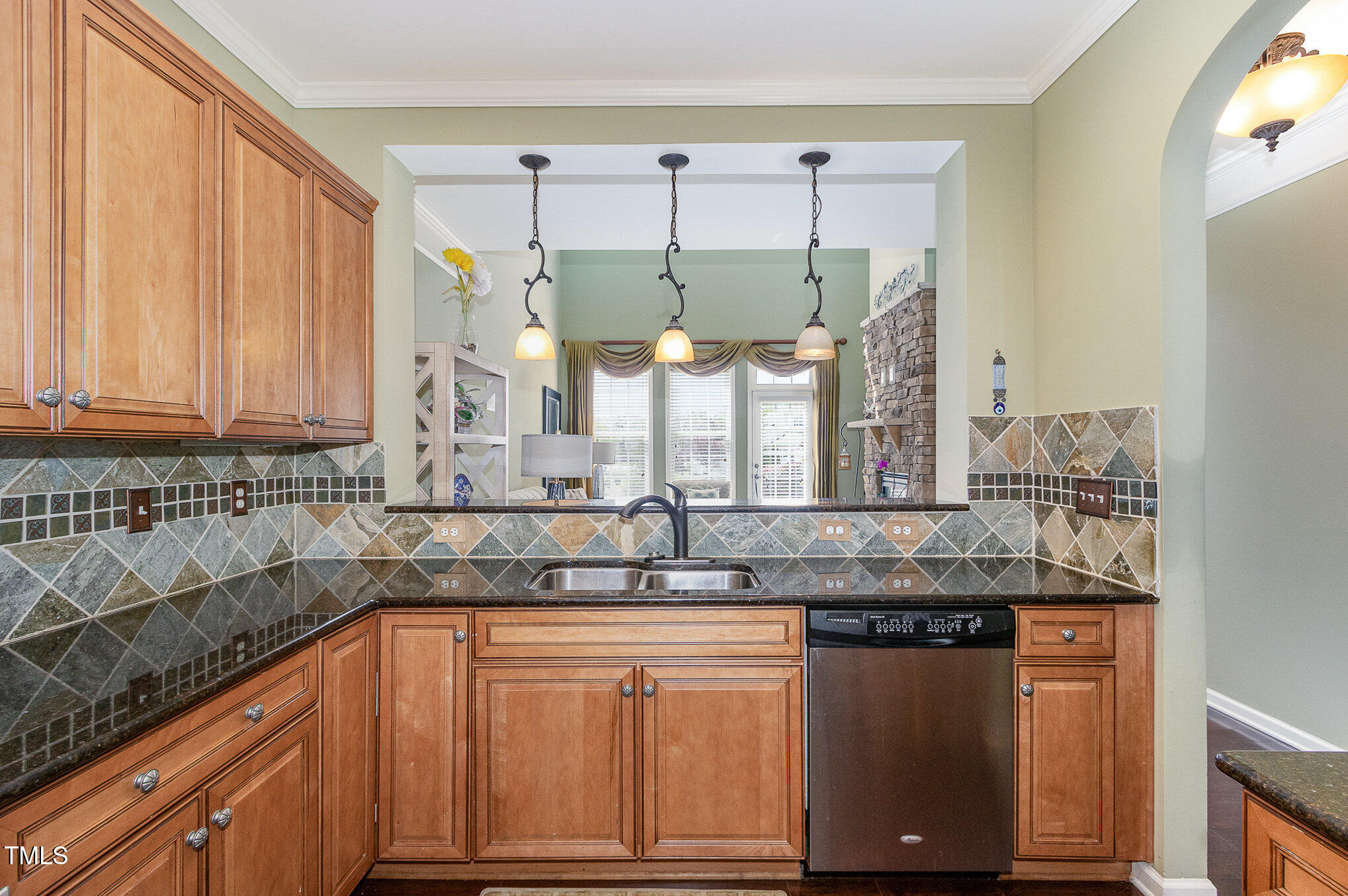 9207 Wooden Road Raleigh, NC 27617 - Photo 8 of 27 a kitchen with stainless steel appliances granite countertop a sink and cabinets