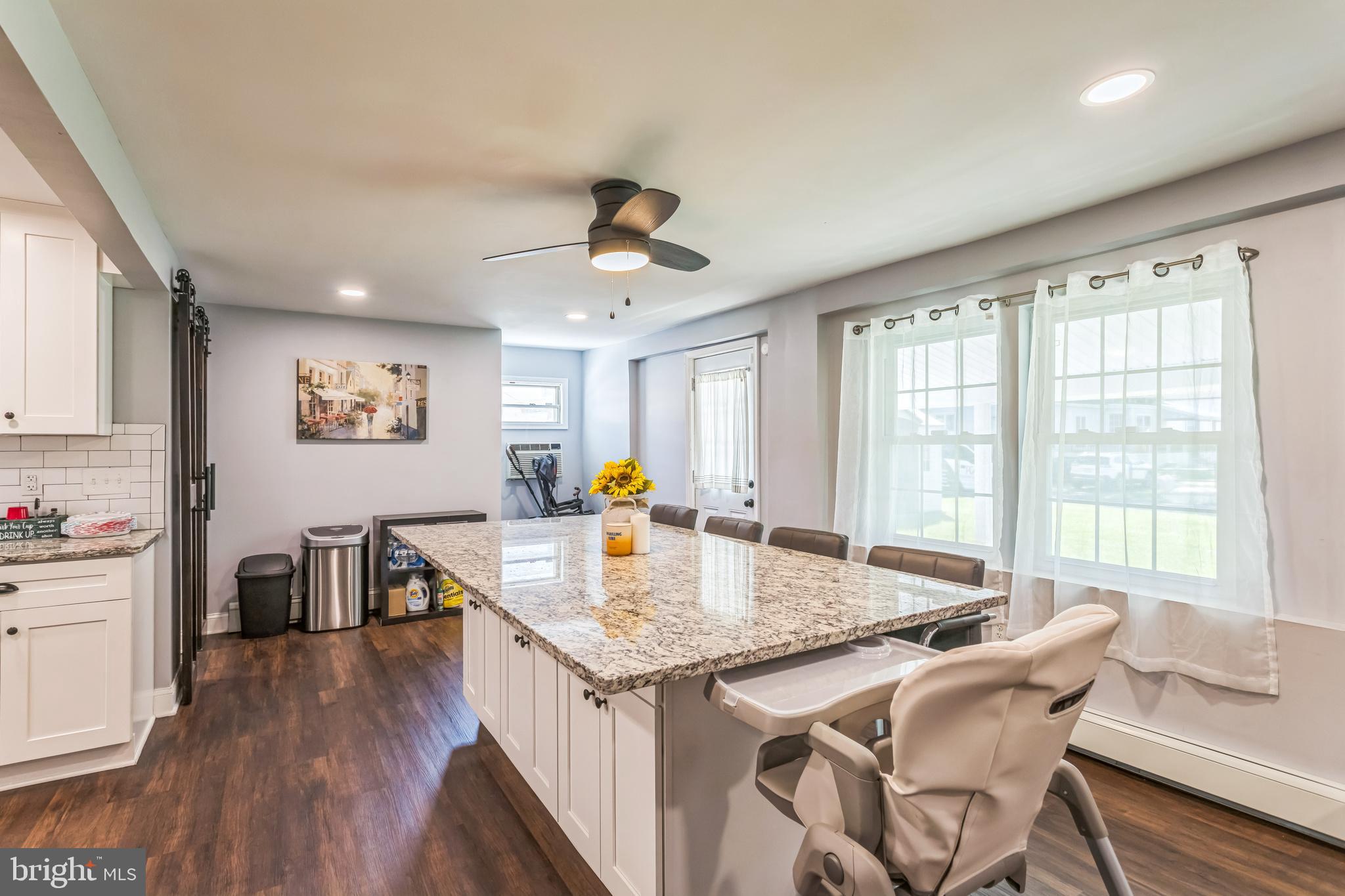 414 Delaware Avenue Croydon, PA 19021 - Photo 15 of 34 a open kitchen with stainless steel appliances granite countertop a sink a stove and wooden floor