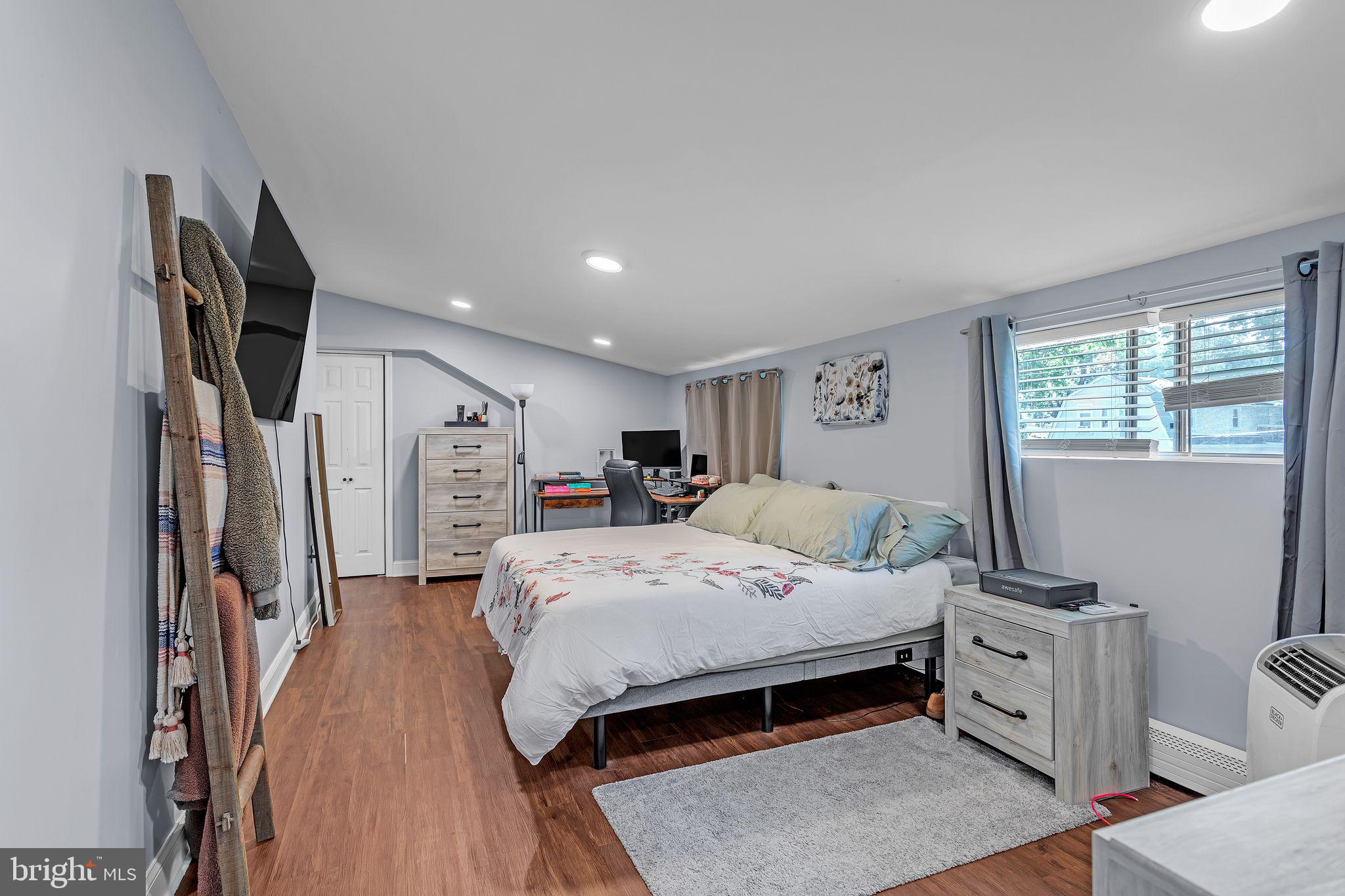 414 Delaware Avenue Croydon, PA 19021 - Photo 22 of 34 a bed room with a bed and a flat tv screen