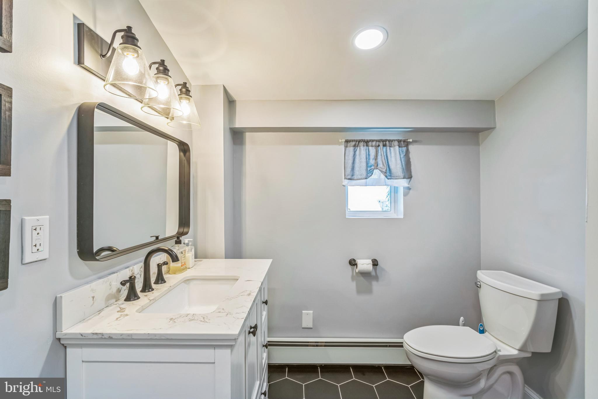 414 Delaware Avenue Croydon, PA 19021 - Photo 27 of 34 a bathroom with a sink vanity mirror and toilet