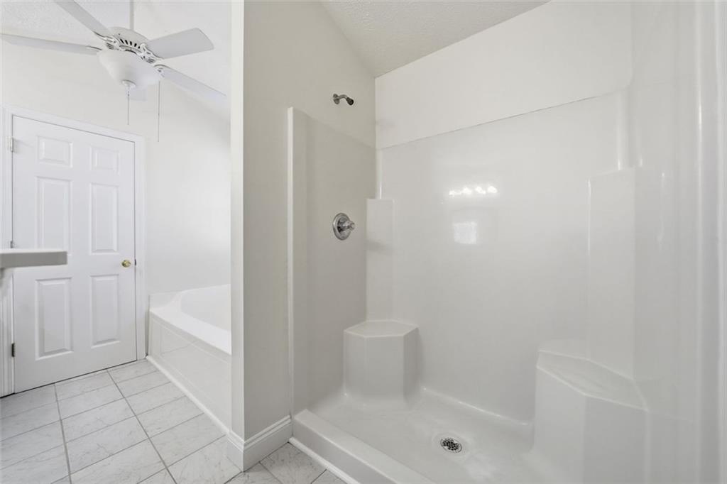 1512 Upper Sassafras Road Jasper, GA 30143 - Photo 24 of 41 a bathroom with a shower a toilet and a shower