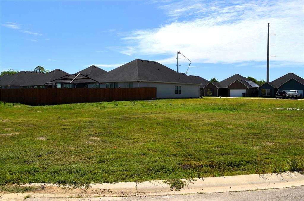 321 Preston Road Mabank, TX 75147 - Photo 1 of 5 a view of large green field with an ocean view