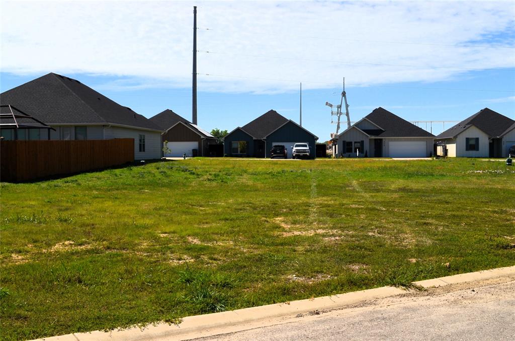 321 Preston Road Mabank, TX 75147 - Photo 2 of 5 a view of a big house with a big yard and large trees