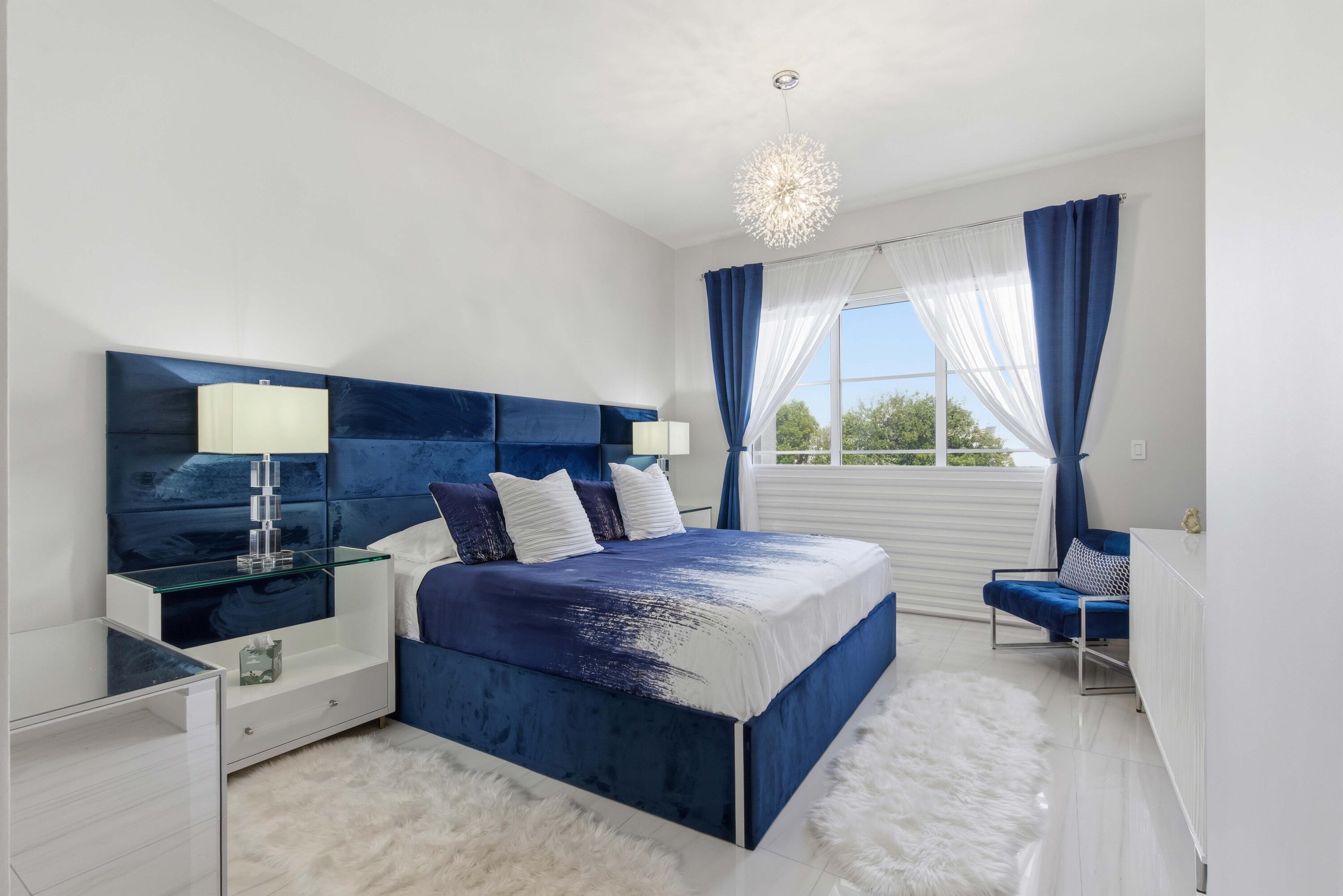 155 East Boca Raton Road, Unit 313 Boca Raton, FL 33432 - Photo 28 of 72 a living room with furniture and a large window