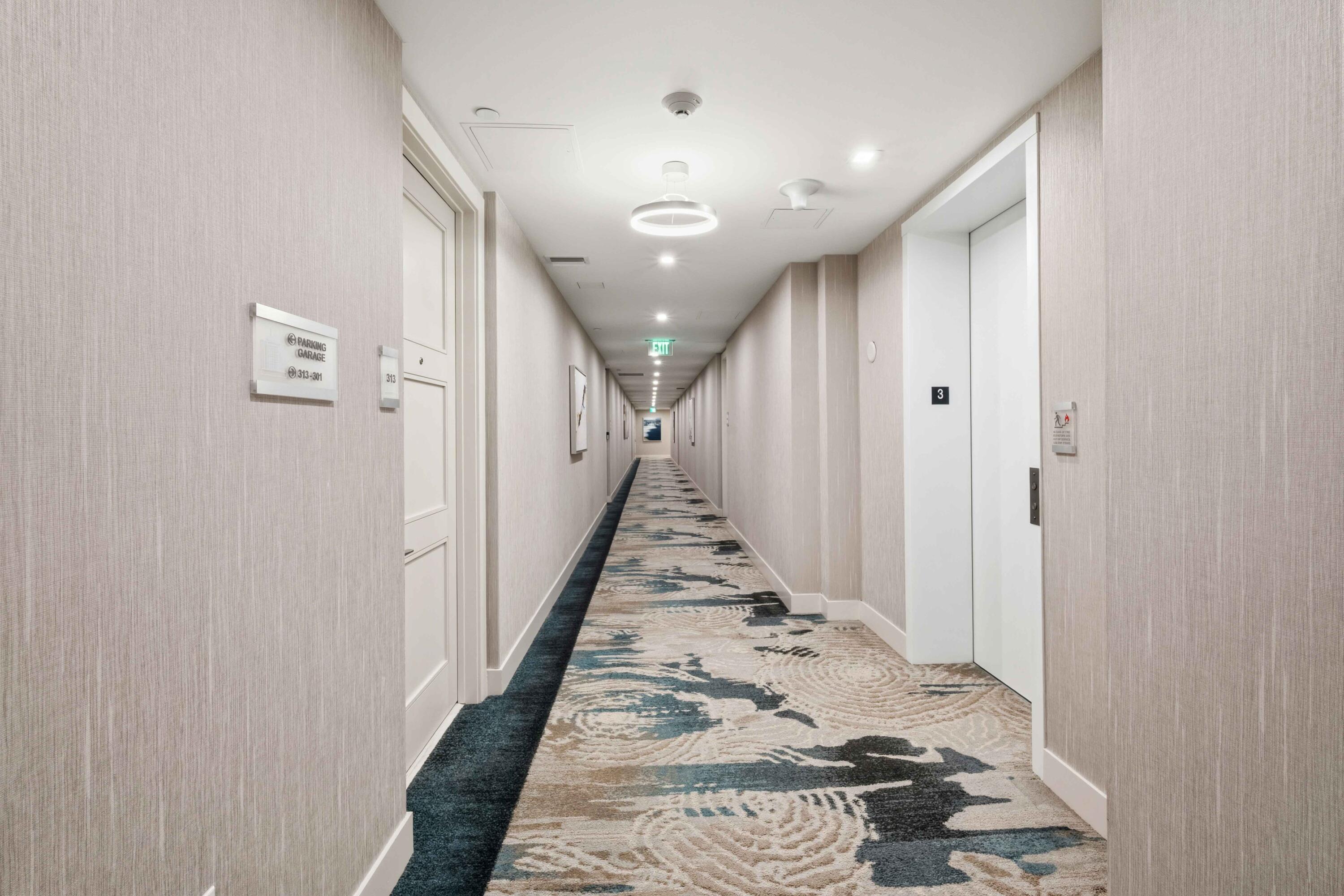 155 East Boca Raton Road, Unit 313 Boca Raton, FL 33432 - Photo 52 of 72 a view of a hallway with wooden floor and staircase