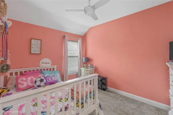 a front view of a bedroom with baby bed