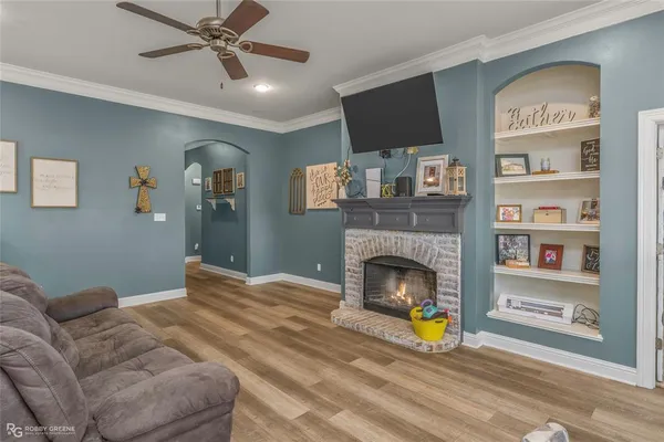a living room with furniture and a fireplace