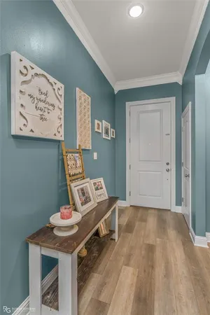 a bedroom with a bed and painting on the wall