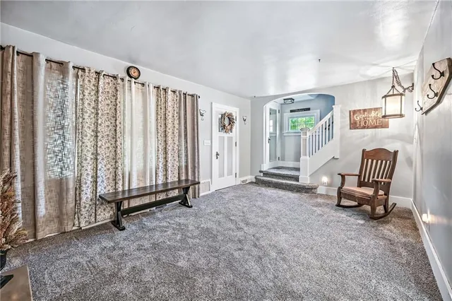 a view of a room with stairs and furniture