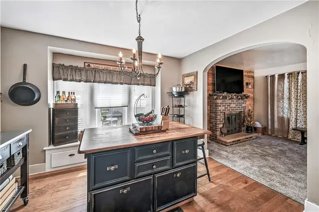 a kitchen with a sink appliances and cabinets
