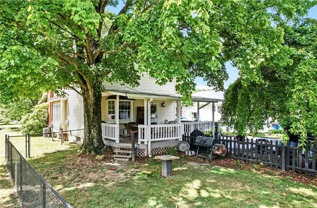 a house view with a sitting space and garden view