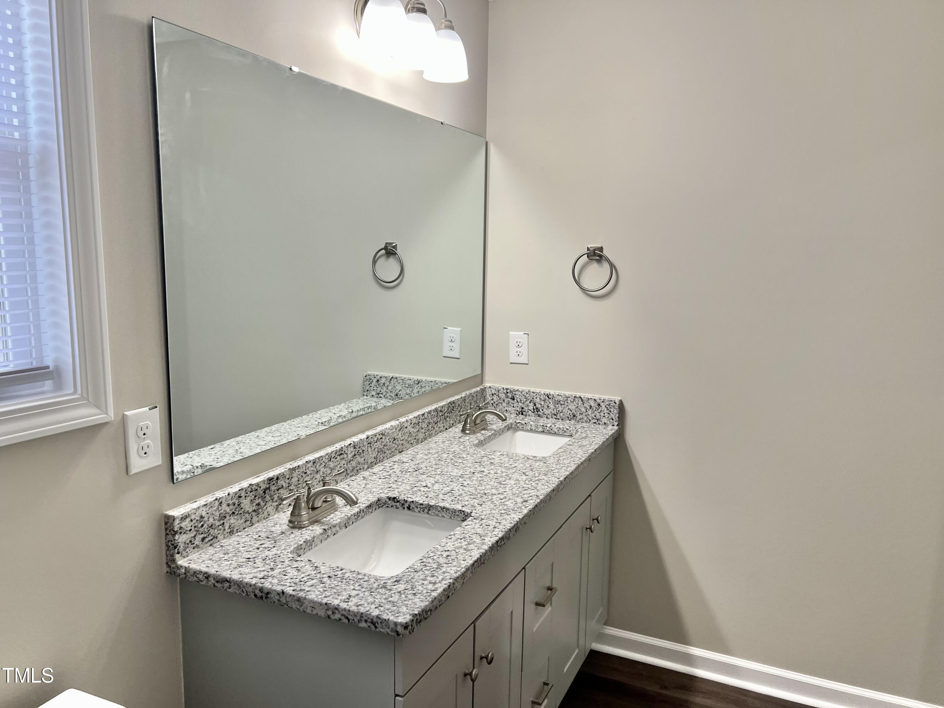 45 Summit Court Cameron, NC 28326 - Photo 11 of 19 a bathroom with a granite countertop sink and a mirror