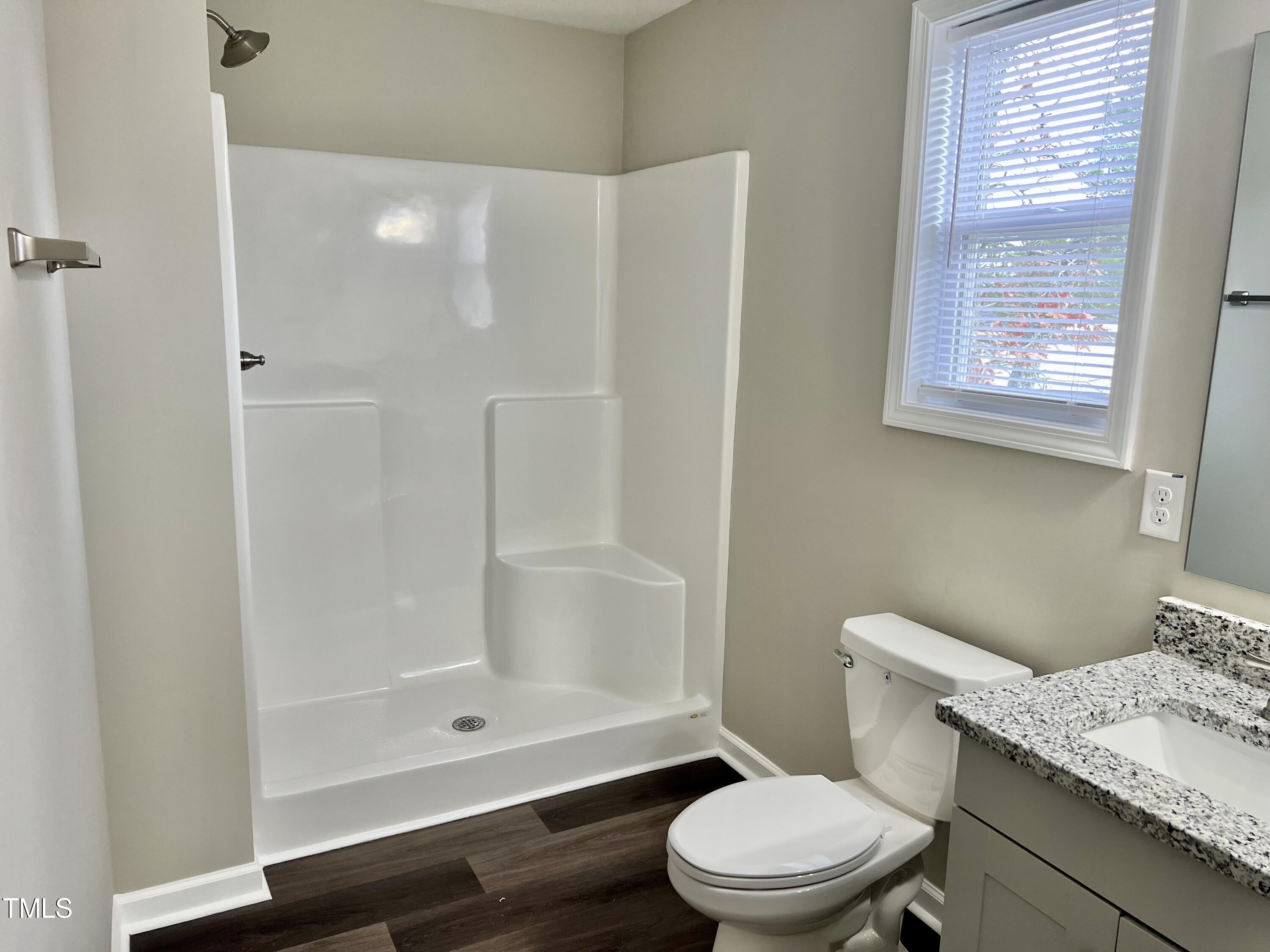 45 Summit Court Cameron, NC 28326 - Photo 12 of 19 a white toilet sitting next to a bathroom sink