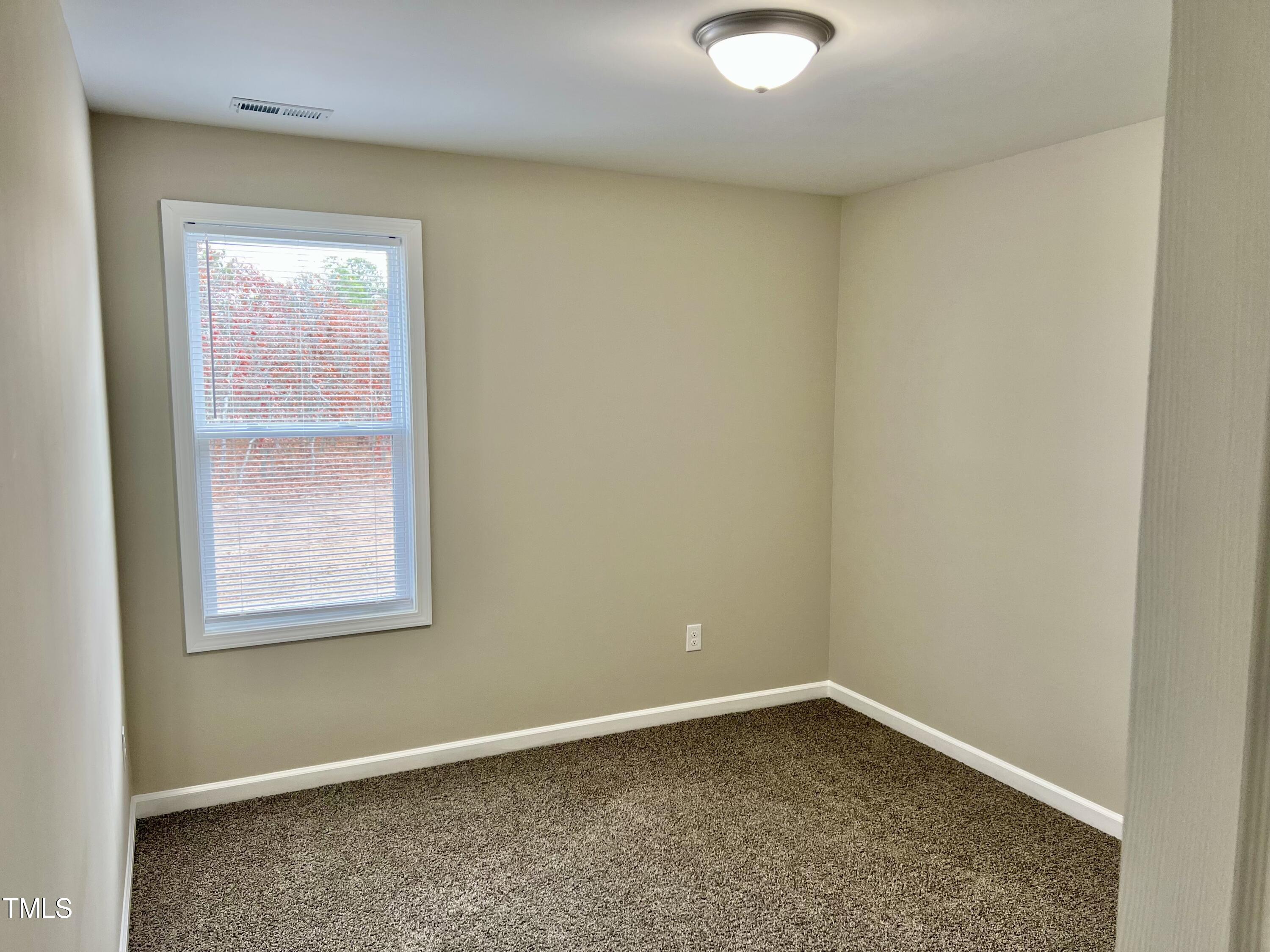45 Summit Court Cameron, NC 28326 - Photo 17 of 19 an empty room with a window