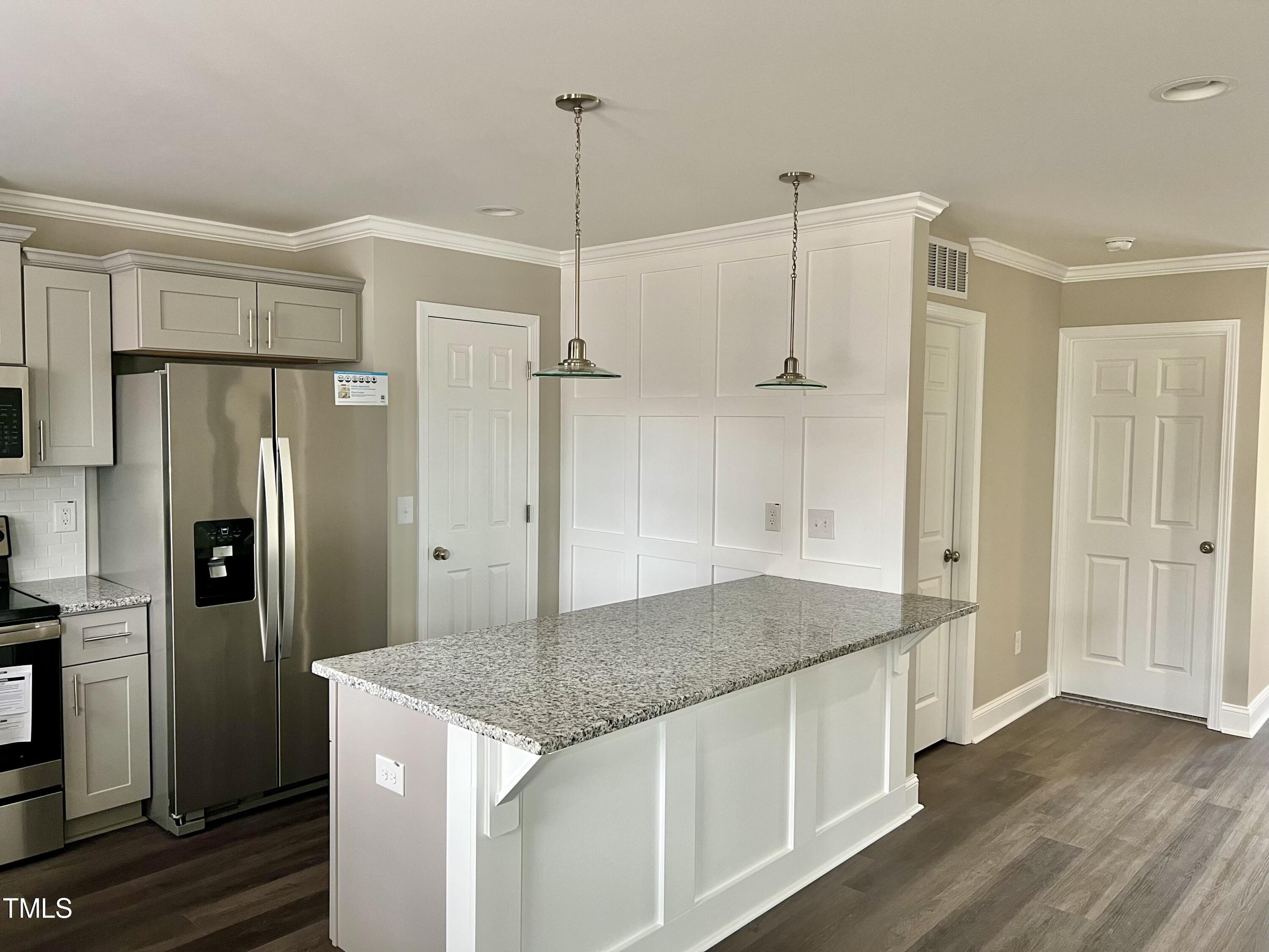45 Summit Court Cameron, NC 28326 - Photo 6 of 19 a kitchen with stainless steel appliances granite countertop a refrigerator a sink and a stove