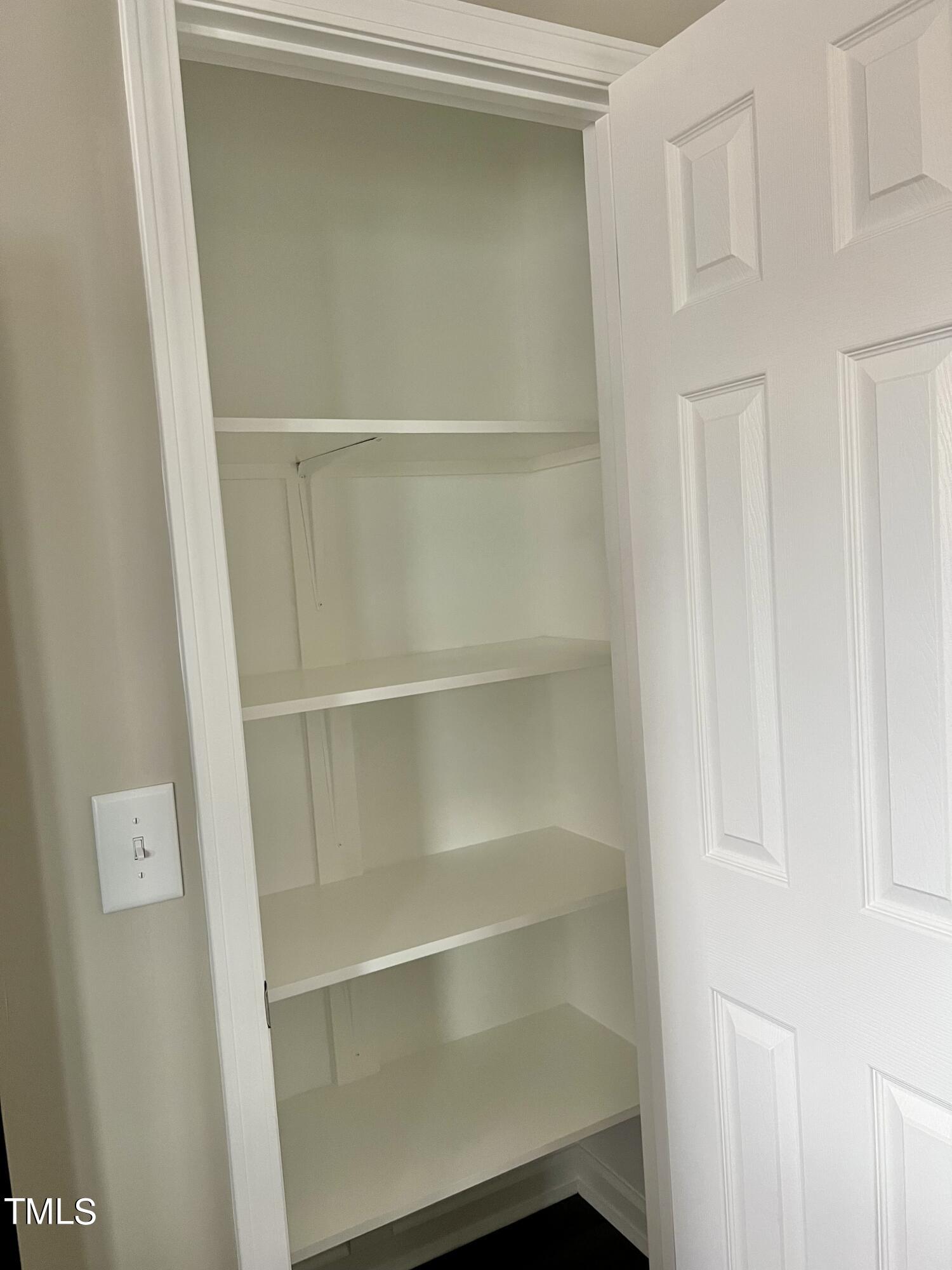 45 Summit Court Cameron, NC 28326 - Photo 7 of 19 a view of walk in closet with empty racks