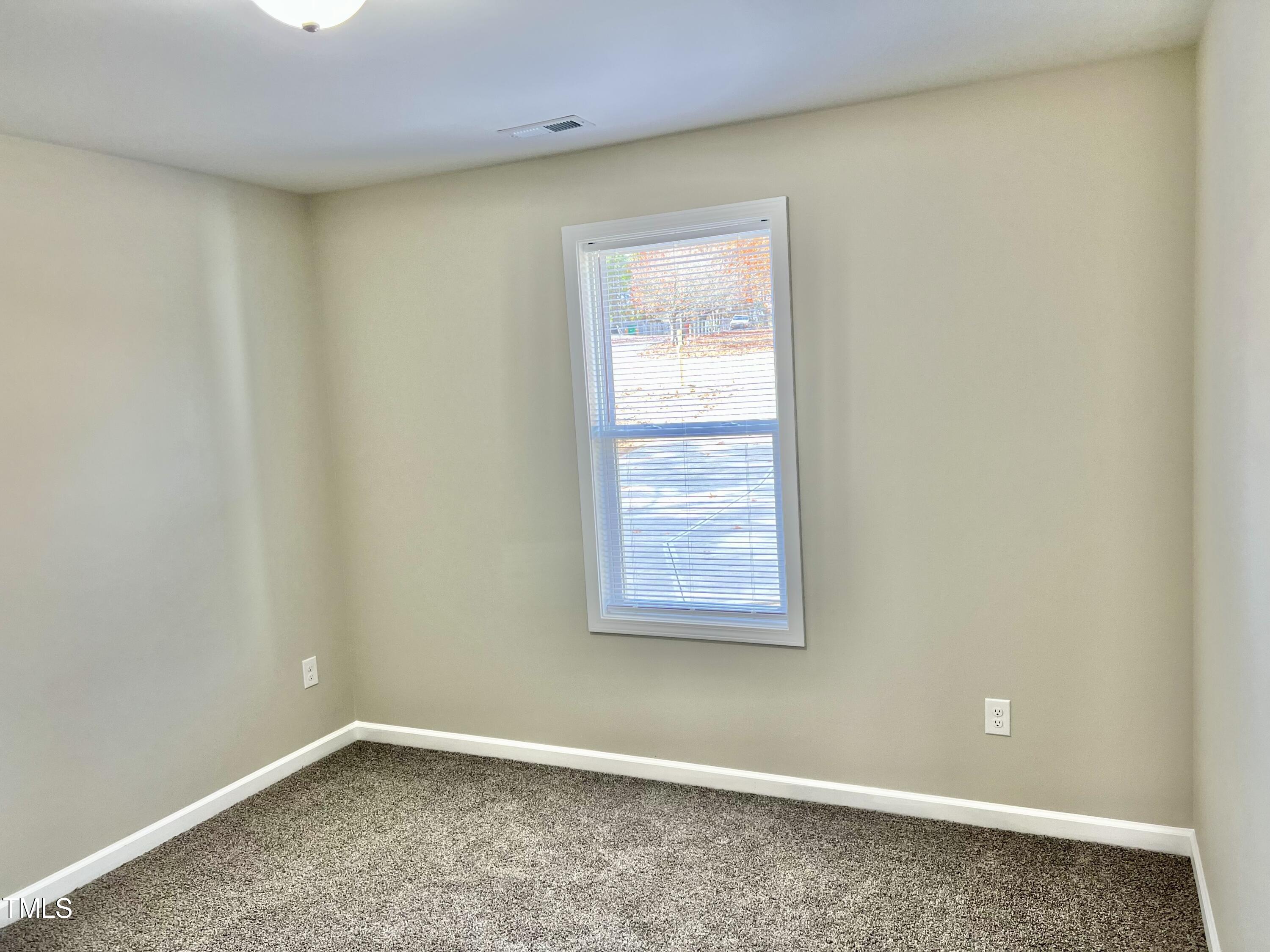 45 Summit Court Cameron, NC 28326 - Photo 9 of 19 an empty room with a window