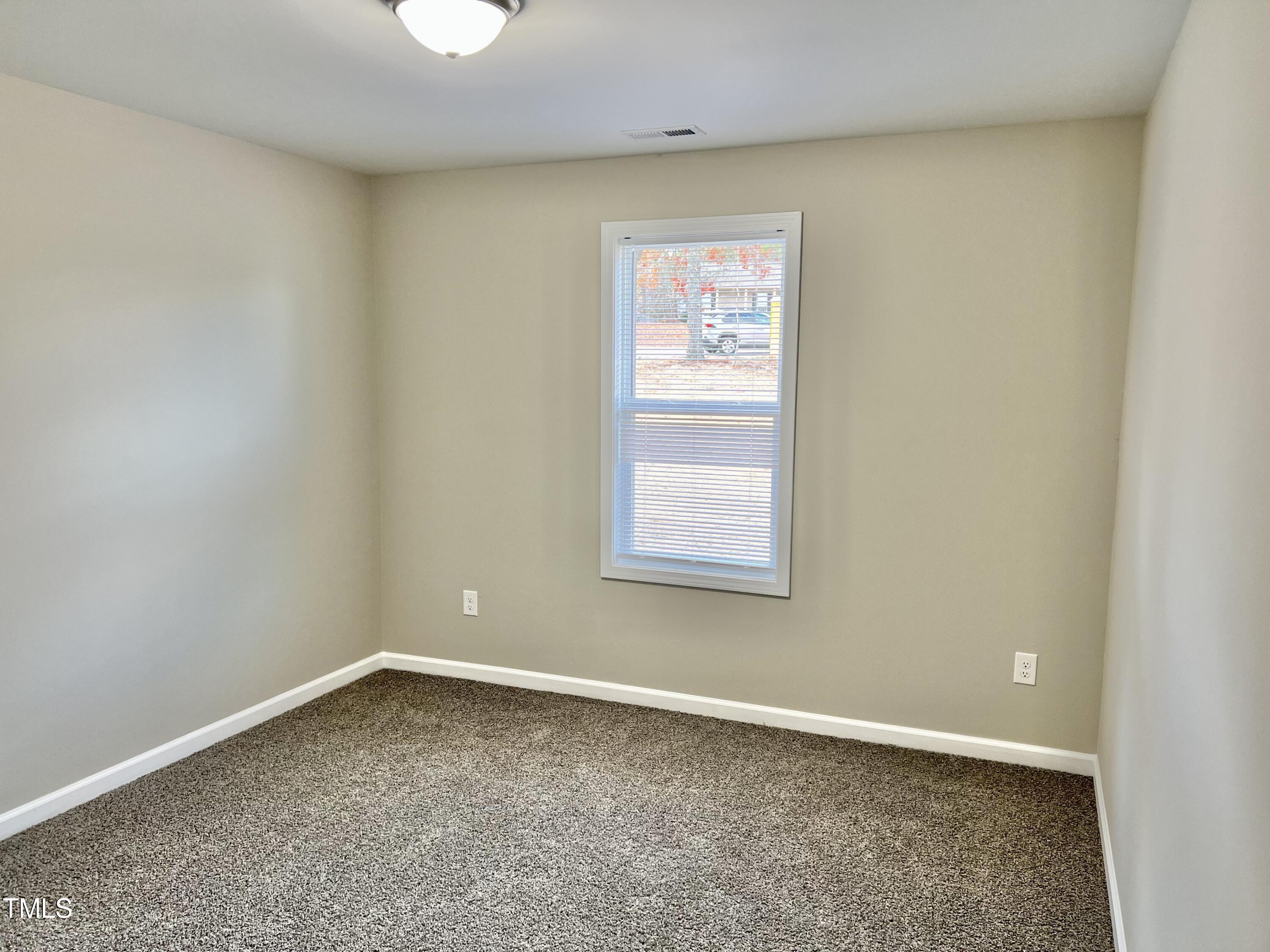 45 Summit Court Cameron, NC 28326 - Photo 10 of 19 an empty room with a window