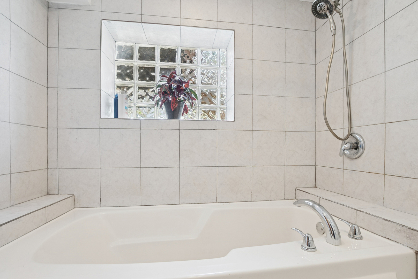 8040 South May Street Chicago, IL 60620 - Photo 19 of 23 a bathroom with a bathtub and shower