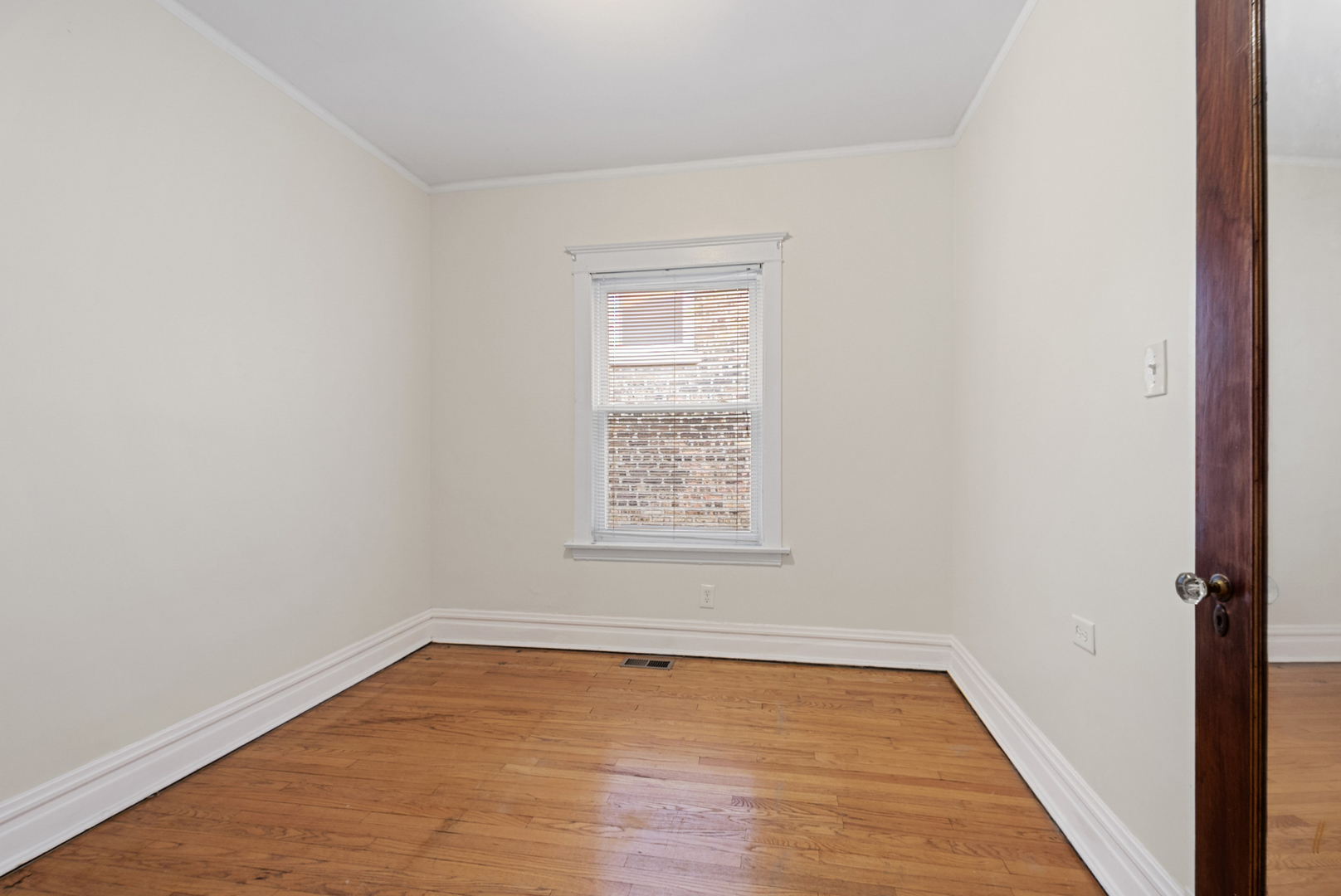 8040 South May Street Chicago, IL 60620 - Photo 7 of 23 an empty room with a window