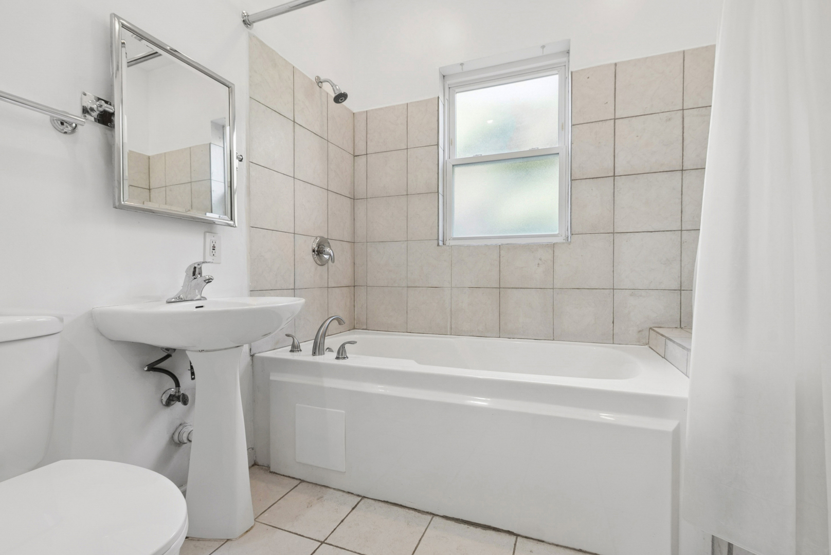 8040 South May Street Chicago, IL 60620 - Photo 10 of 23 a bathroom with a sink a toilet and shower