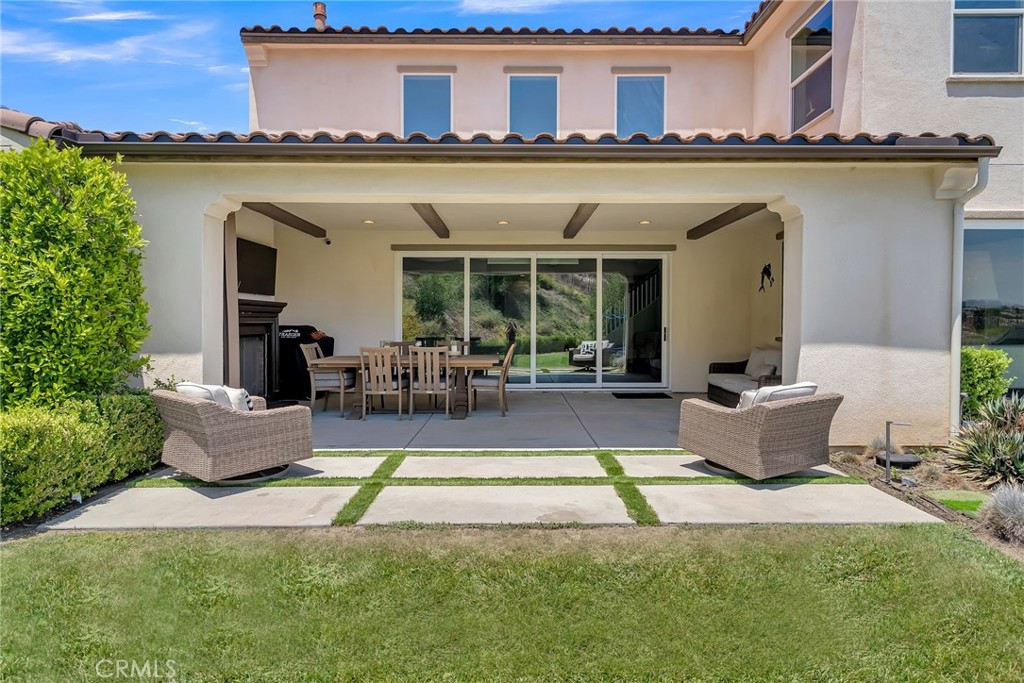 12237 Cortona Place Riverside, CA 92503 - Photo 13 of 17 a view of a patio with couches chairs and potted plants