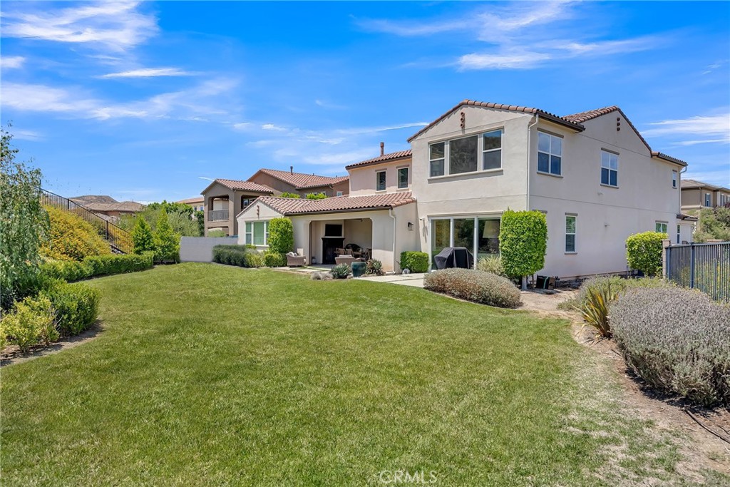 12237 Cortona Place Riverside, CA 92503 - Photo 14 of 17 a front view of a house with a yard