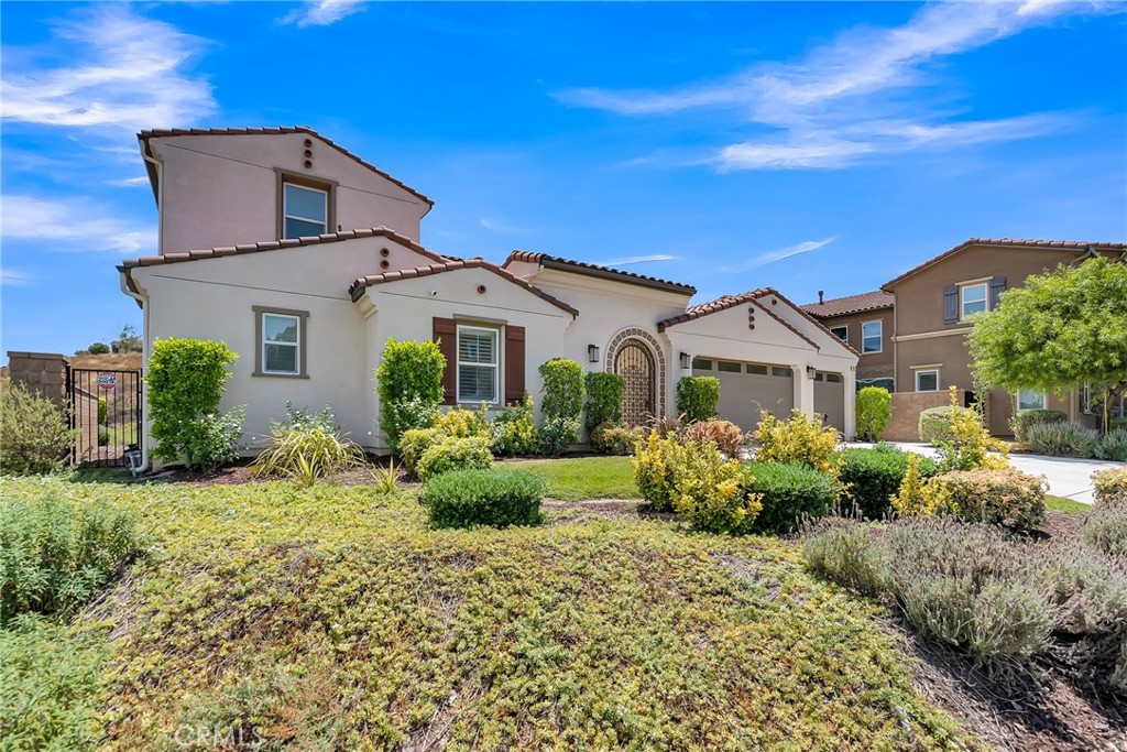 12237 Cortona Place Riverside, CA 92503 - Photo 17 of 17 a front view of a house with garden