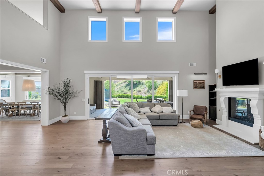 12237 Cortona Place Riverside, CA 92503 - Photo 9 of 17 a living room with furniture fireplace and flat screen tv