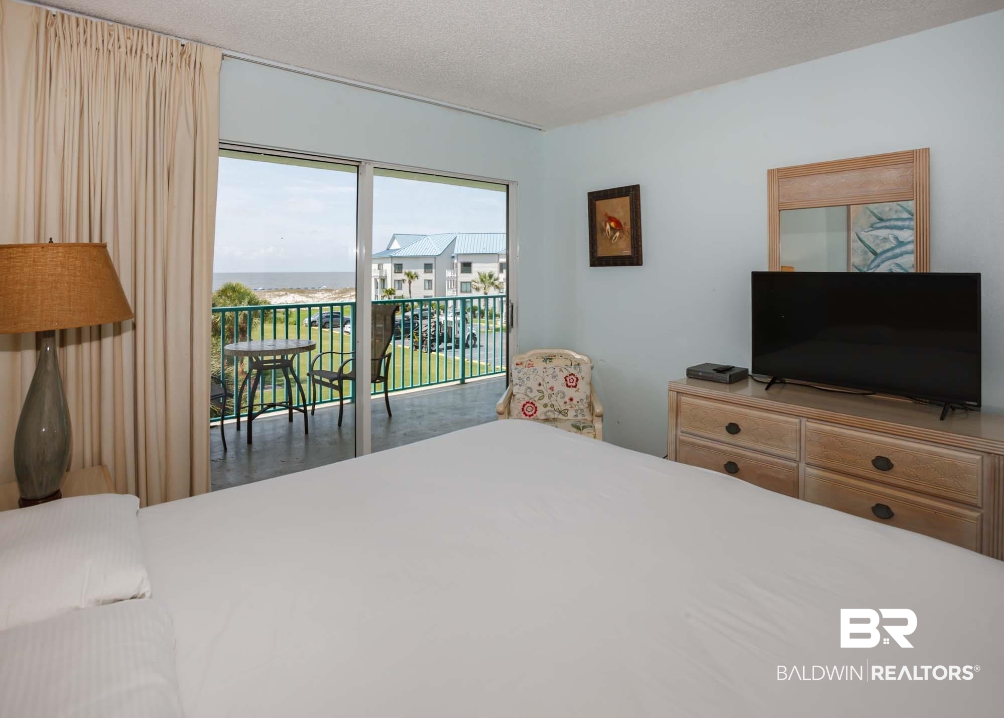645 Plantation Road, Unit 6311 Gulf Shores, AL 36542 - Photo 17 of 43 Bedroom with access to outside and a textured ceiling